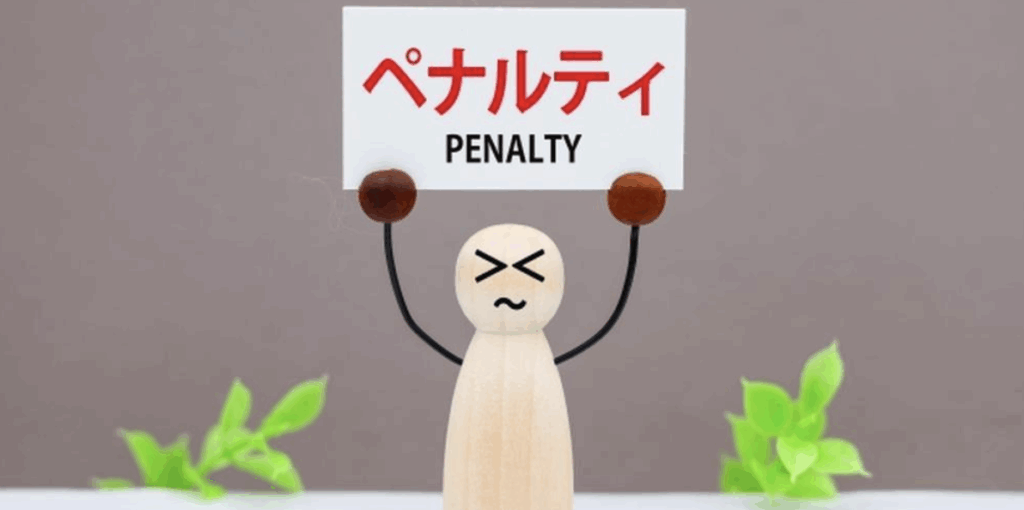 ペナルティと書かれたプレートを掲げている木製人形